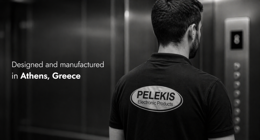 Man seen from behind, wearing a PELEKIS Electronic Products polo in a dim industrial setting, with the text 'Designed and manufactured in Athens, Greece' overlaid.